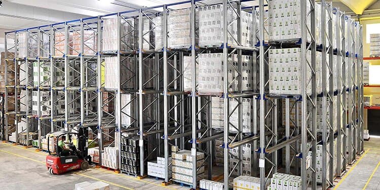 Compact storage racks in a warehouse