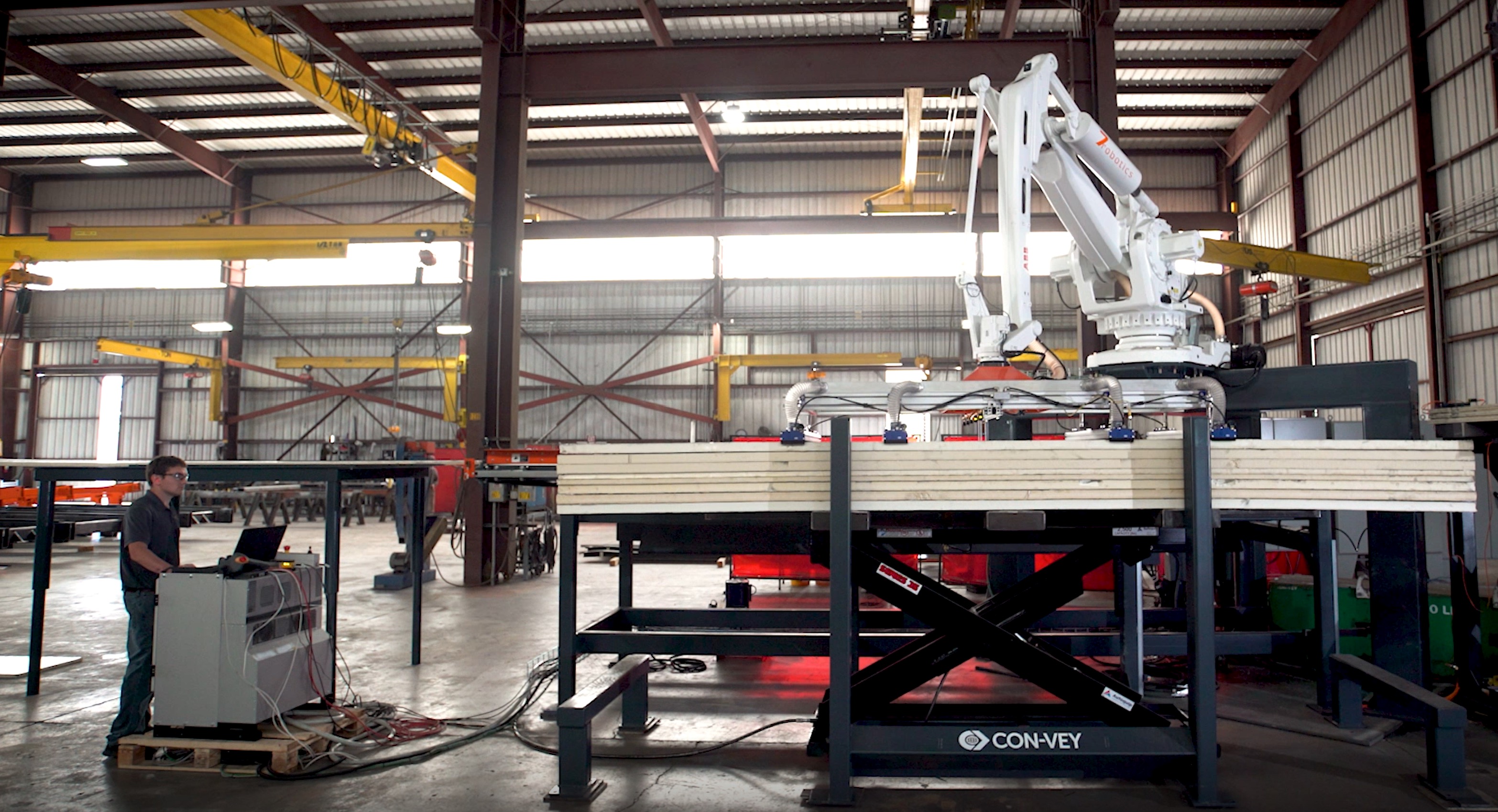 Heavy-Duty Powered Scissor Lift Integrates With Automated Robotic Stacking Line